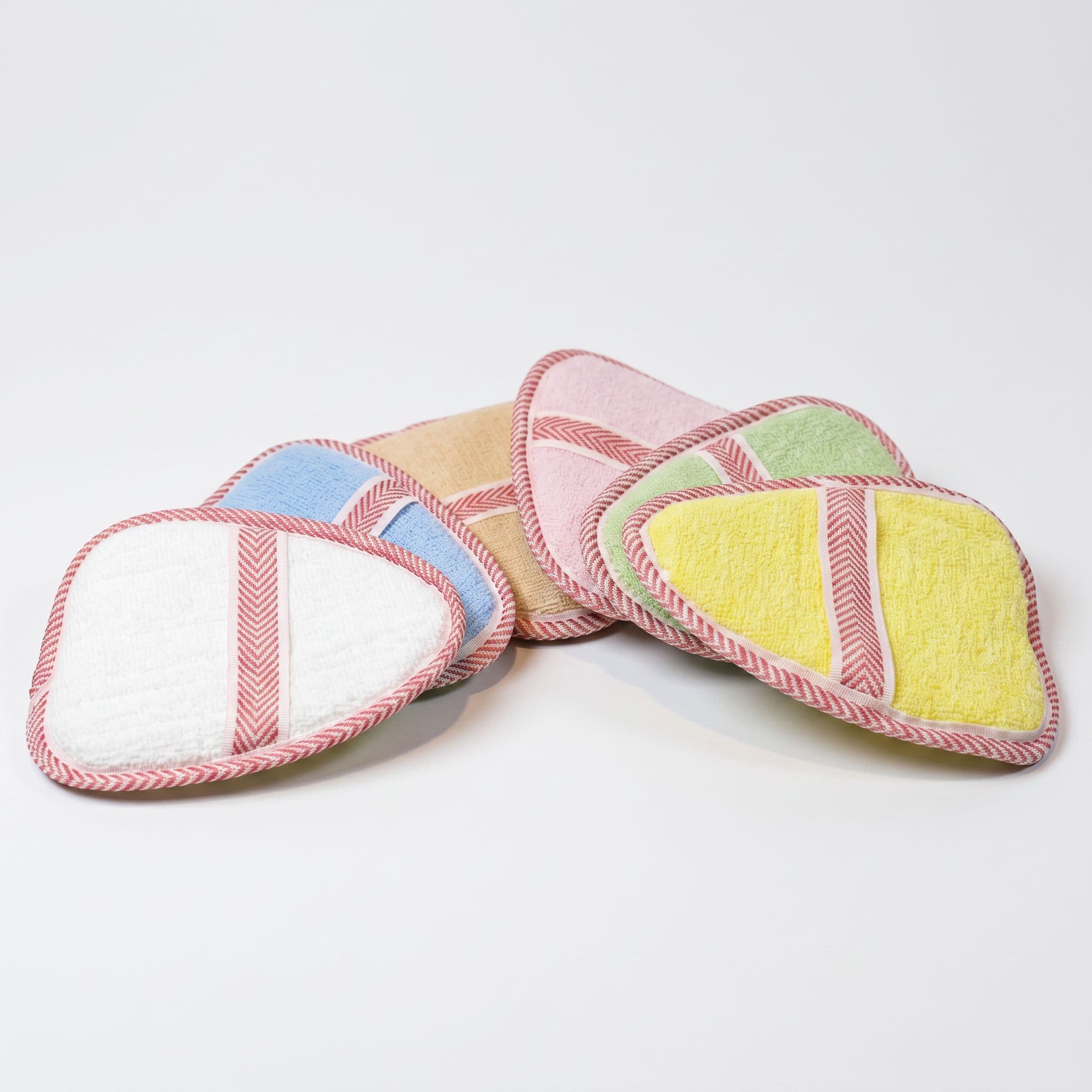 Loofah pads with woven binding