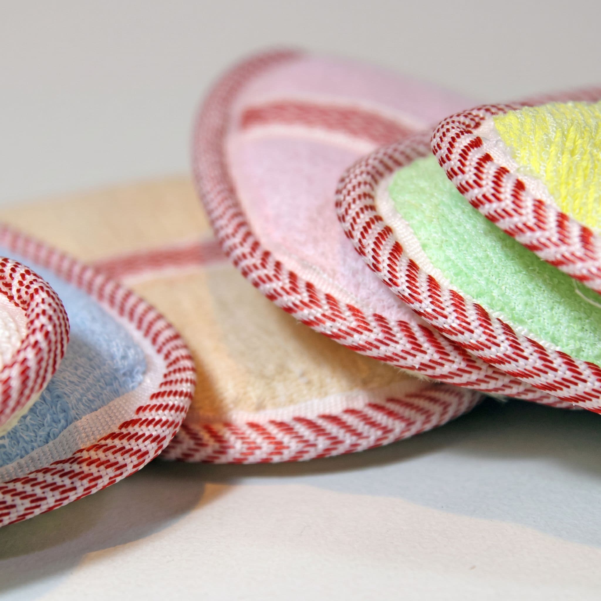 Loofah pads in pastel colors